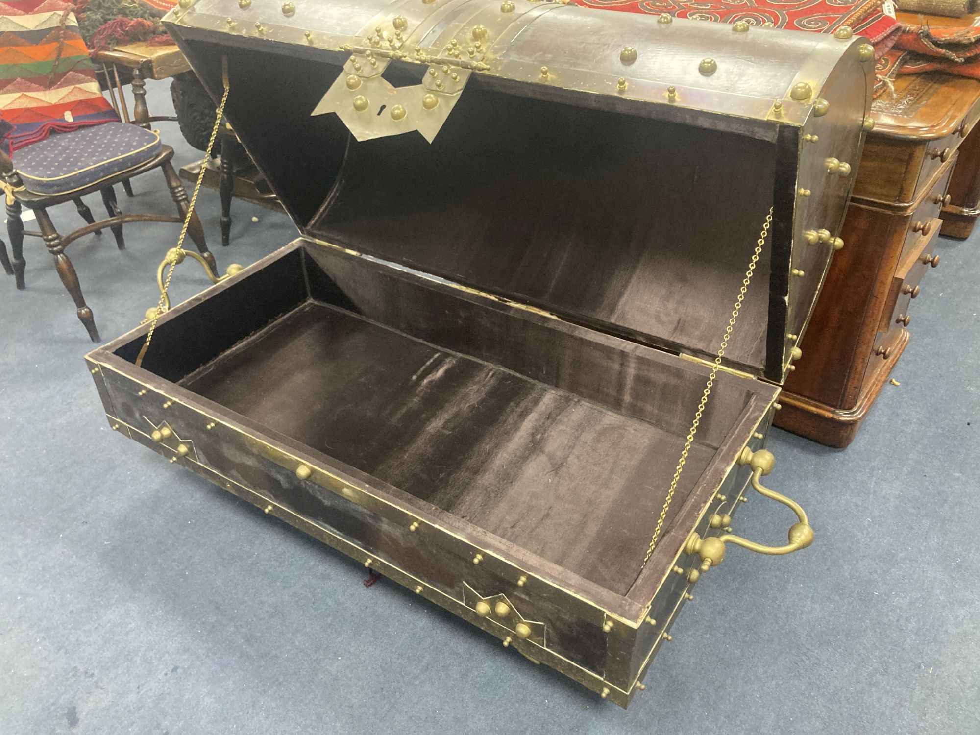 An ormolu and brass mounted leather dome top coffer,